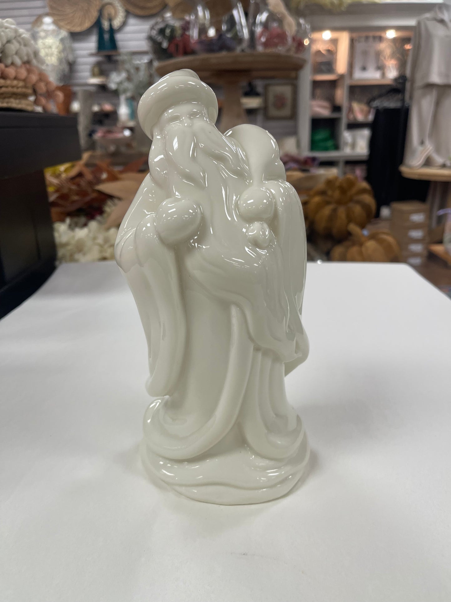 Porcelain Santa Carrying Bag Figurine 9”